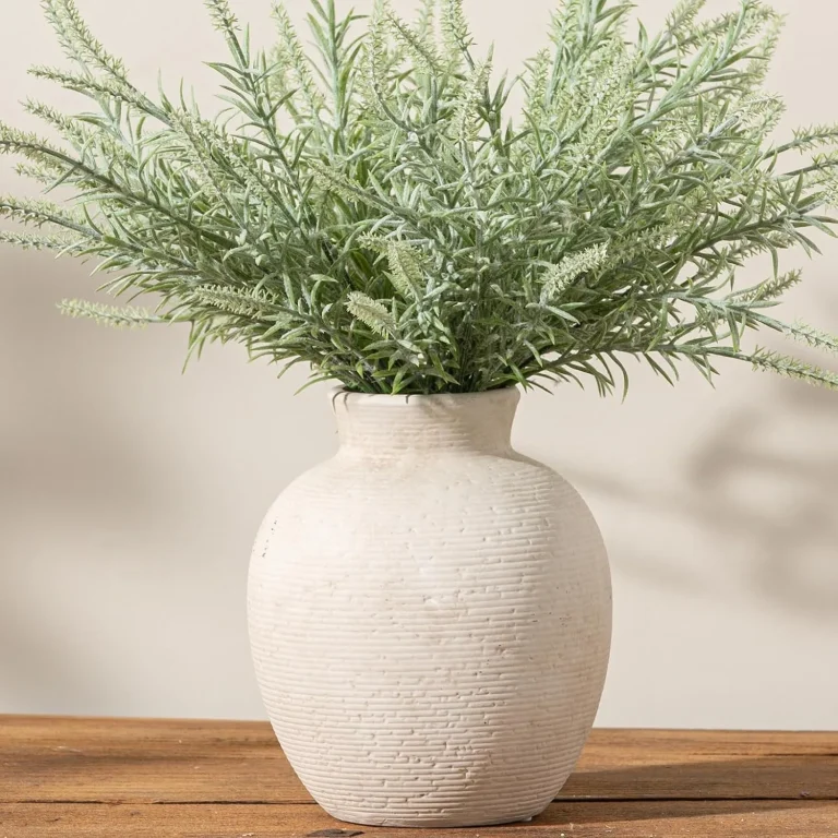 Rustic handcrafted ceramic flower vase on a wooden table